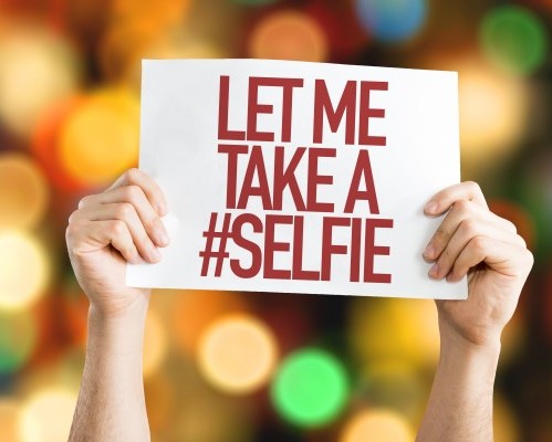 Let Me Take a #Selfie placard with bokeh background